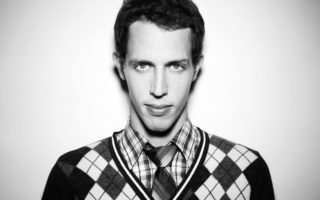 a black and white photograph of the standup comedian Tony Hinchcliffe